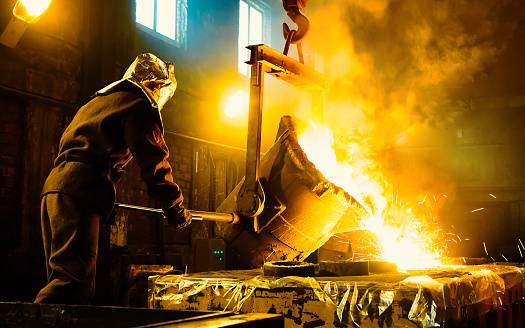 The liquid metal is poured into molds.